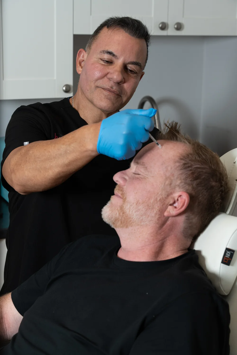 Michael Fressola performing an injectable treatment at Skin Med Spa
