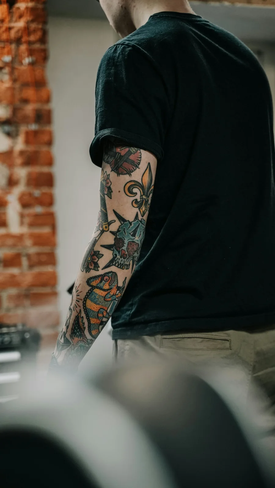 Colorful traditional tattoos on a forearm