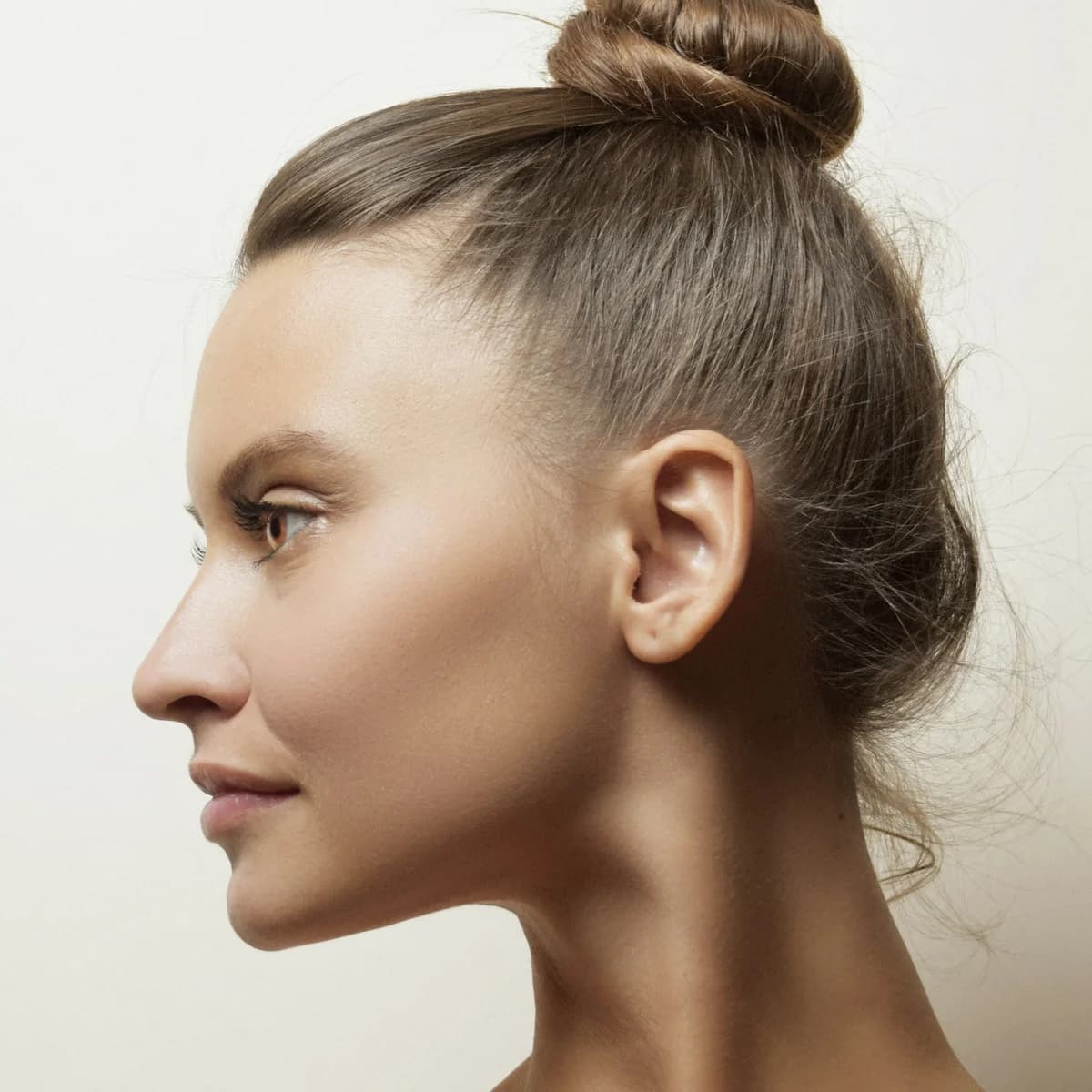 Side-profile portrait showing a woman's cheek, chin, and jawline